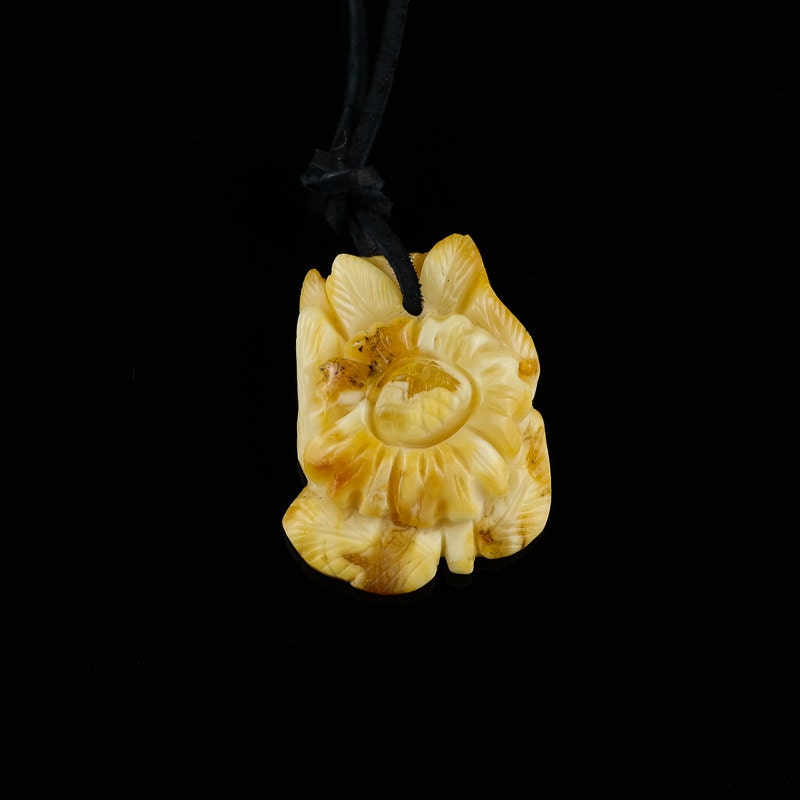 Amber amulet camomile